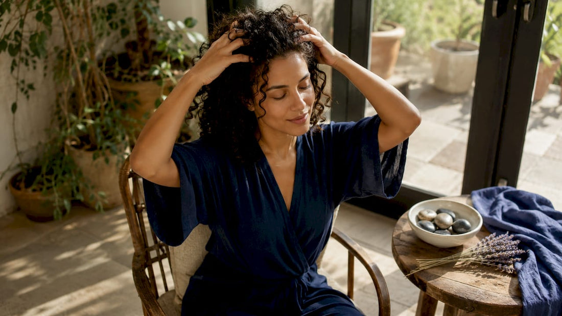Woman massaging scalp for hair health