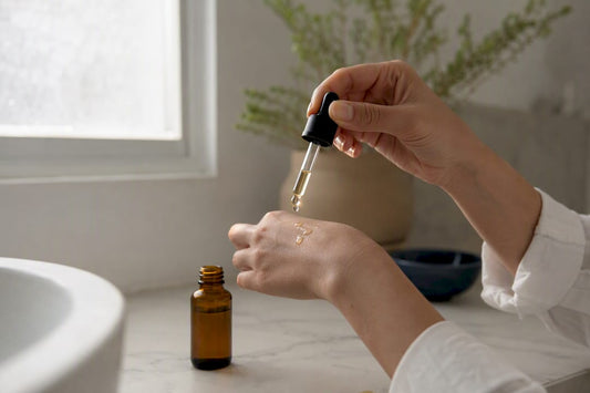Hand applying lightweight facial oil