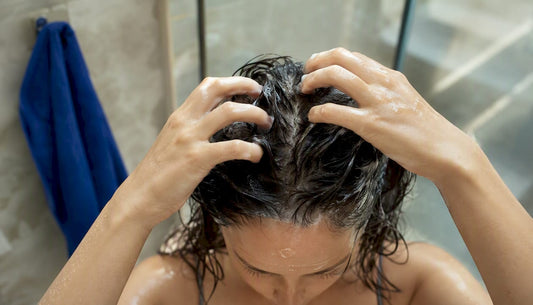 Woman gently cleansing an oily scalp