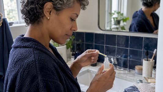 Woman checking shampoo with a pH strip