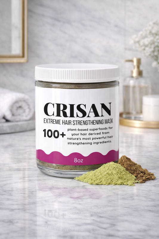 Crisan extreme hair strengthening mask jar on a marble surface with ingredients.