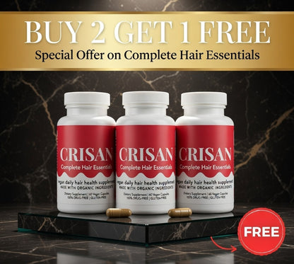 Three bottles of CRISAN Complete Hair Essentials with a 'Buy 2 Get 1 Free' offer on a dark marble background.
